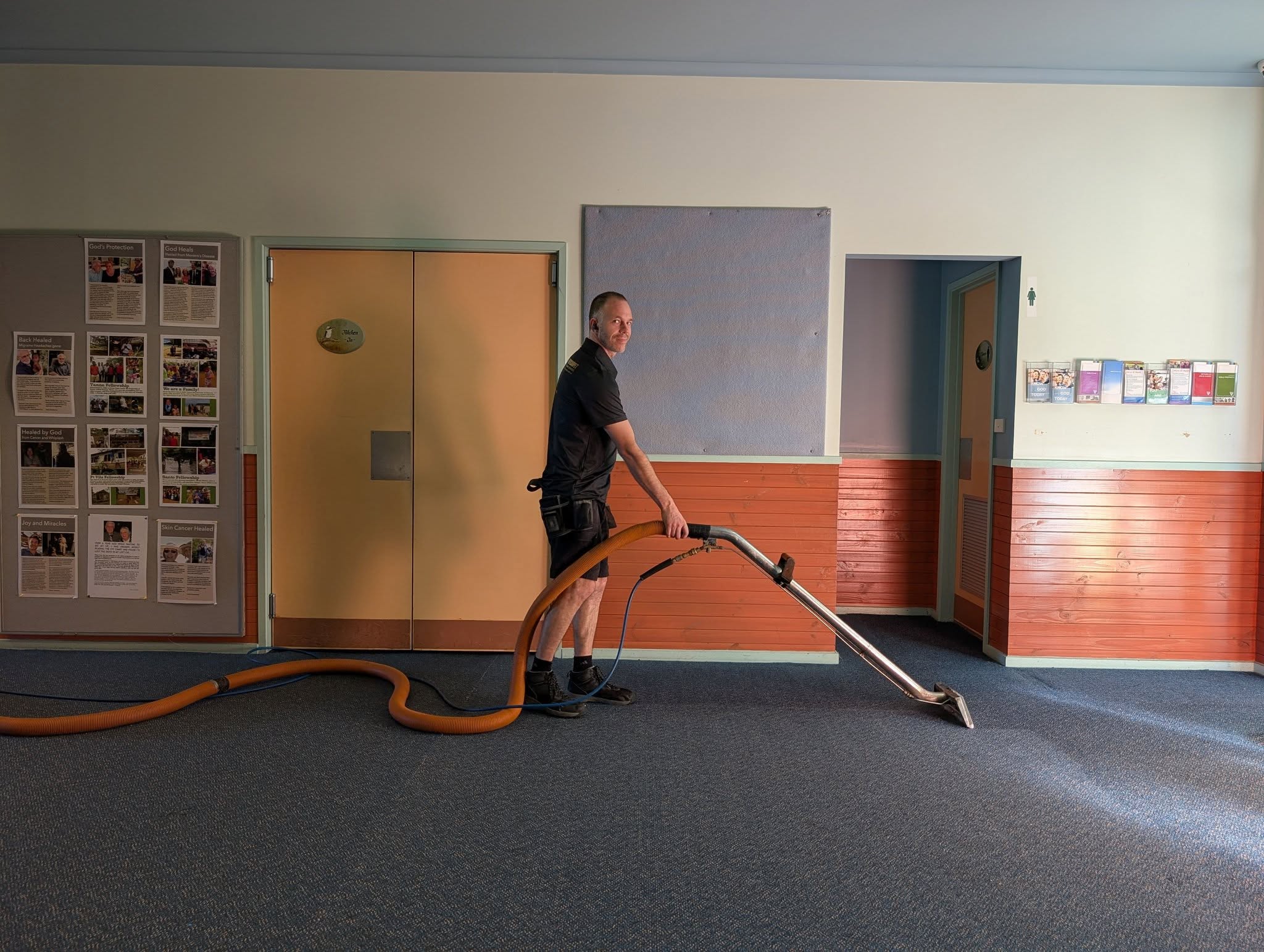 Josh cleaning carpet professionally in a Canberra home